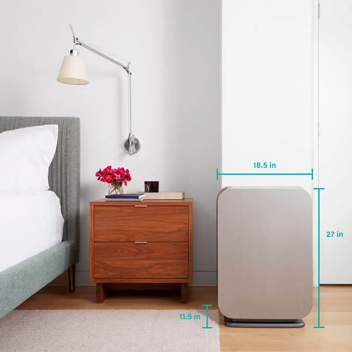 BreatheSmart 75i beside a bed, 27 inches high by 18.5 wide by 11.5 deep